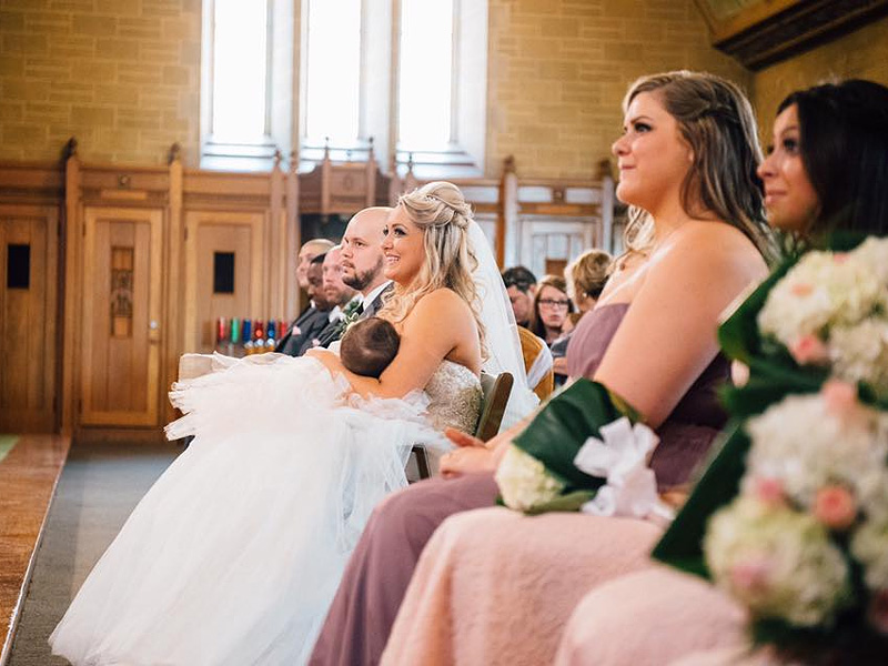 Christina Torino-Benton, who breastfed her daughter during her wedding and now the photo is going viral. Credit: Lana Nimmons Permission securted by Julie Mazziotta